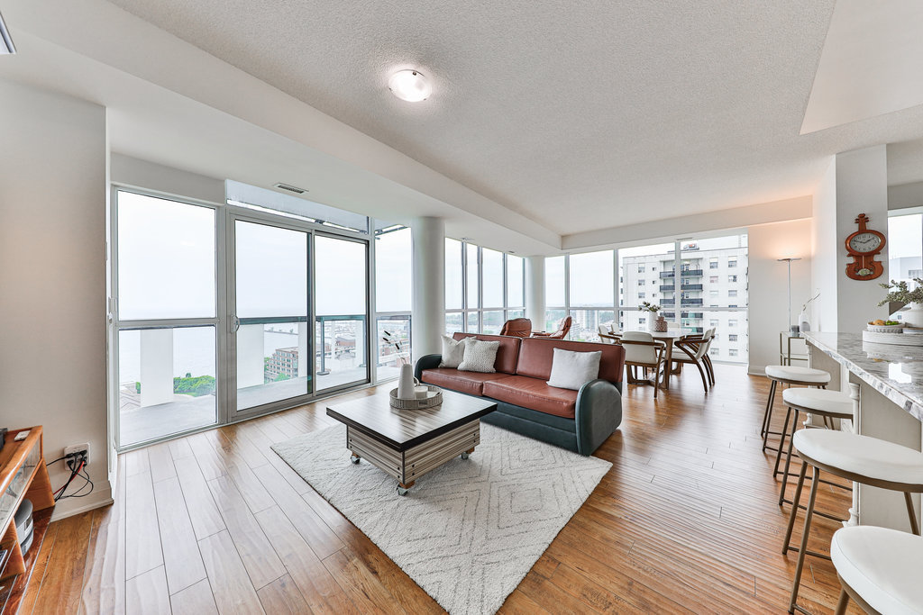 Spacious luxury condo interior with floor-to-ceiling windows and expansive views in Mississauga