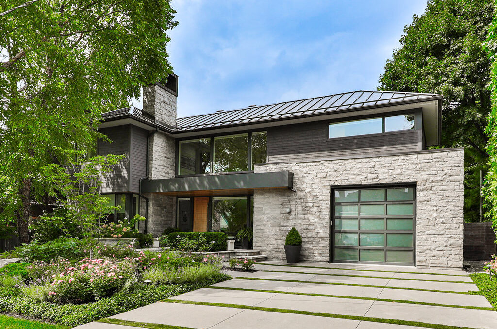 Contemporary luxury home with landscaped grounds and mature trees in Oakville